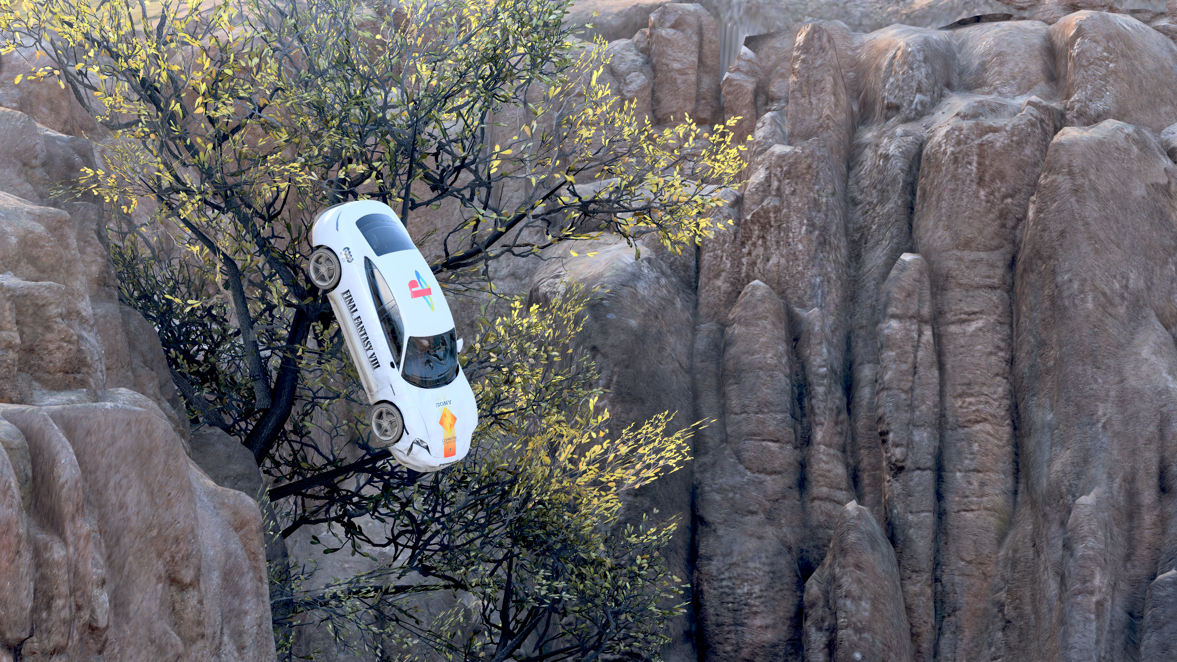A white Porsche decorated with the Final Fantasy VIII logo on the side, the Sony Interactive Entertainment logo on the hood, and the PlayStation 1 logo on the roof. It is careening off a cliff at a near-vertical angle.