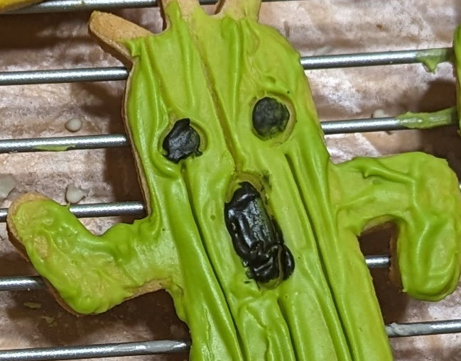 A closeup of a Cactuar sugar cookie that looks like it's screaming.
