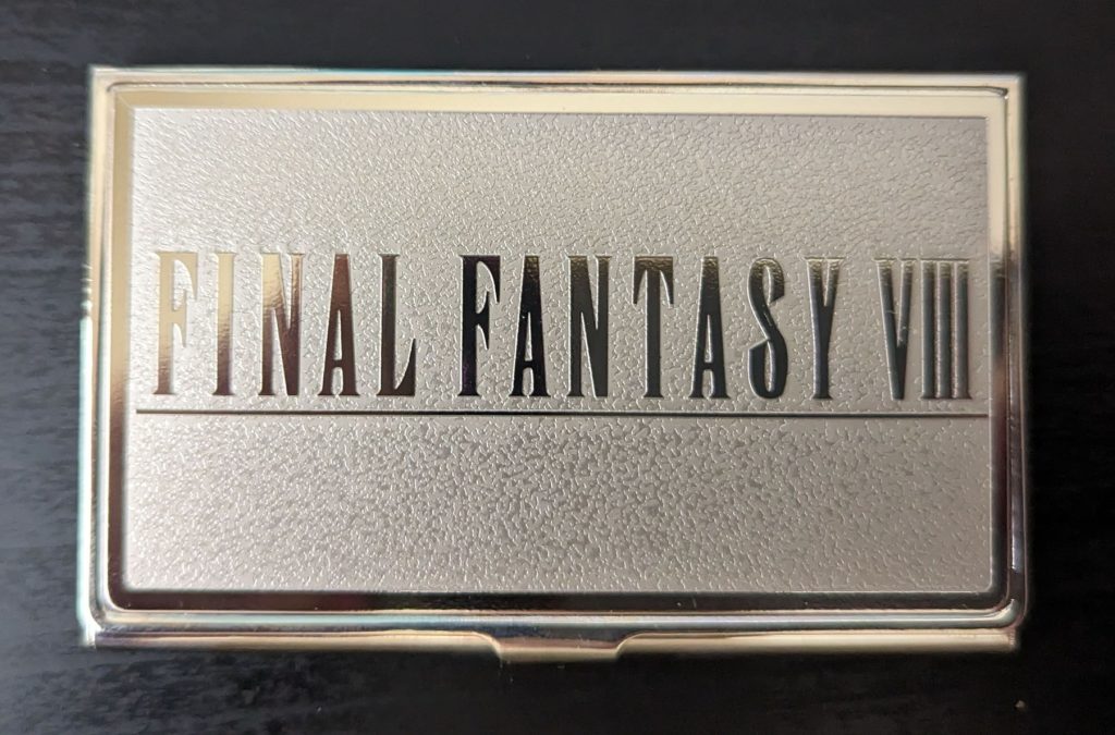 A business card holder with the Final Fantasy VIII logo on the front.