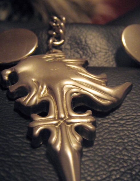 A Griever necklace on a leather jacket.