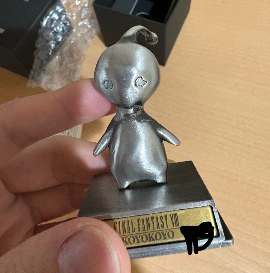 A chrome PuPu figurine.