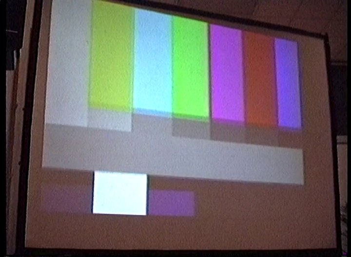 Color test bars on a projector screen.
